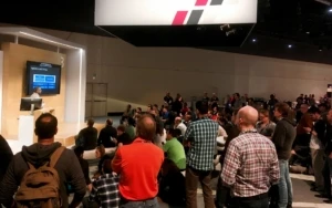 a group of people standing in front of a crowd