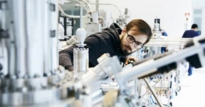 Materials scientists using state of the art lab equipment to synthesize quantum crystals