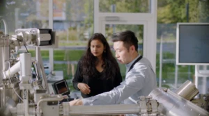 Two people working on a Quantum system